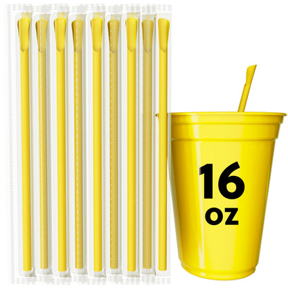 Yellow scoop straws with spoon-shaped tip next to a yellow 16 oz cup for frozen drinks