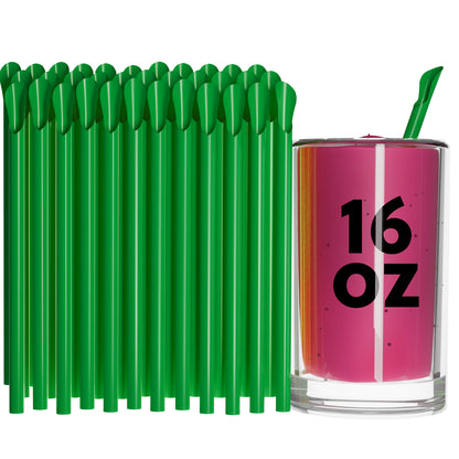 Green Unwrapped Classic Spoon Straws next to a 16 oz glass of pink beverage with one straw inserted